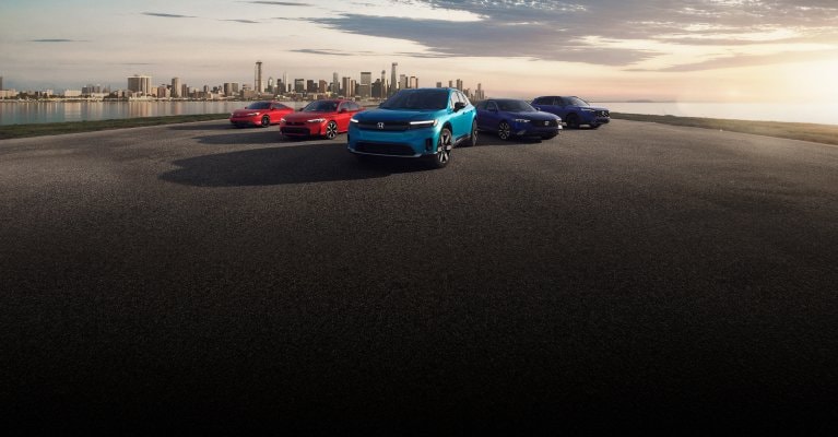 2026 Honda Electrification lineup parked with the city far in the background, showing Prelude, Civic Sedan, Prologue, Accord and CR-V. 2026 Honda Electrification lineup parked with the city far in the background, showing Prelude, Civic Sedan, Prologue, Accord and CR-V.