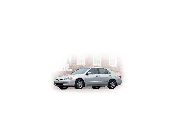 2005 Honda Accord, three-quarter view, with a city in the background. 2005 Honda Accord, three-quarter view, with a city in the background.